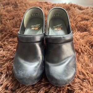 Dansko Woman’s Black Clogs